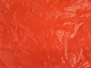 Abstract red crumpled plastic bag texure background 
