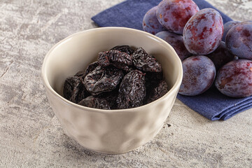Black dry sweet prunes heap