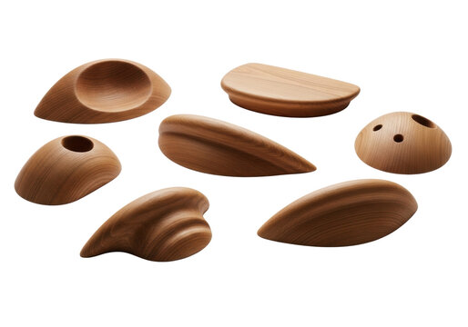 Seven polished oak rock climbing holds (jugs, slopers, crimps) meticulously arranged on a transparent background, defined by precise rim lighting and macro texture focus, concept of artisan