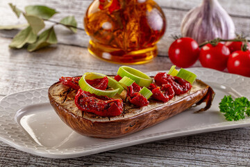 Baked eggplant with tomato and leek