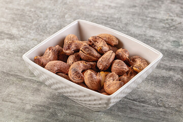 Unpeeled cashew nuts in the bowl