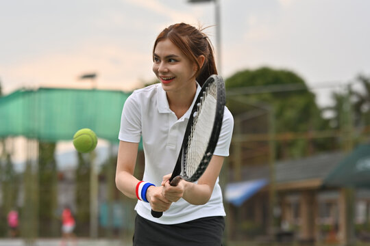 Teen tennis athlete preparing to hit an incoming ball, showing concentration, technique, and an active sporty lifestyle