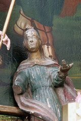 Saint John under the cross, statue on the main altar in the parish church of Our Lady of Sorrows of Carinthia in Krizevci, Croatia