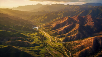 Vibrant landscape showcasing rolling hills, valleys, and a winding river during golden hour in a mountainous region