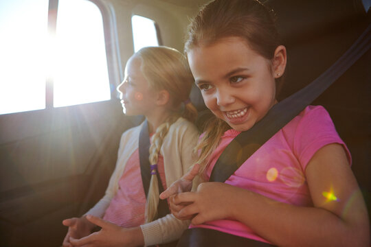 Happy, children and travel in car for road trip with love, holiday adventure and bonding. Smile, kids and sisters relaxing in vehicle for transport, family connection and vacation journey for getaway