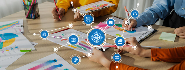 Startup company employee working together, analyzing BI dashboard paper on financial data report and planning strategic marketing for business success in panorama banner. Synergic Amity © InfiniteFlow