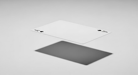 White blank business card concept floating above a dark rectangle shadow on a neutral background