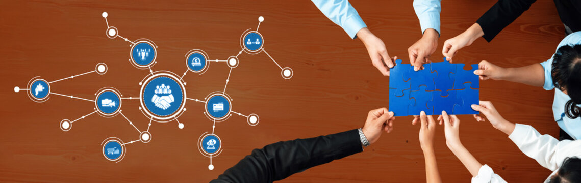 Diverse hands come together to form a unified strategy on a business puzzle, symbolizing collaboration, innovation, and effective communication for corporate growth. Amity