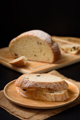 Freshly baked sourdough bread   on a black background