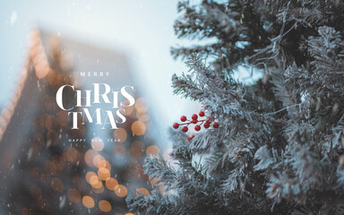 Merry Christmas and happy new year concept, Frosted pine branch with red berries and falling snow against warm Christmas bokeh lights, creating a festive winter holiday background perfect