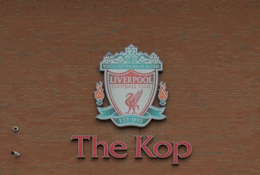 ANFIELD, LIVERPOOL, ENGLAND - JULY 15, 2025 : The Kop and Liverpool football club crest on Anfield Stadium in Liverpool, England. LFC has become English most successful football club in UK.