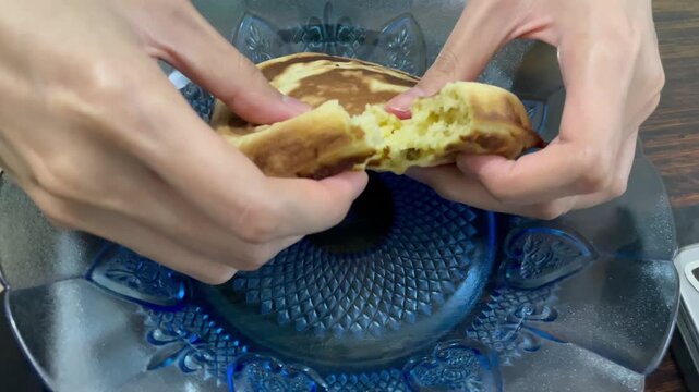 Video melted mozzarella cheese pull from korean hotteok pancake