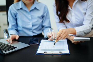 Business team collaboration discussing working analyzing with financial data and marketing growth report graph in team, presentation and digital tablet, laptop.