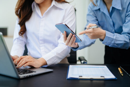 Team work process. Photo young business crew working with new startup project. Project managers meeting. Analyze plans, papers in office