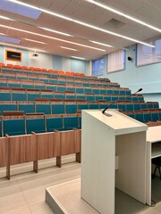 a podium tribune in an amphitheater-style classroom
