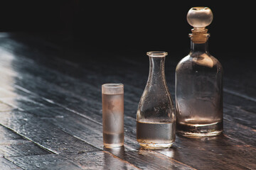 Chilled tequila served in a frosted glass, highlighted by festive winter holiday ambiance, evoking a celebratory New Year mood.