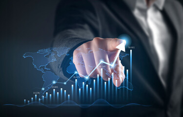 Businessman hand pointing at a futuristic digital interface with a bar chart showing financial growth, stock market success, and business progress.