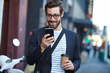 Phone, coffee and businessman in town for walking in morning to creative job with contact. Cellphone, networking and male editor with email on mobile app with takeaway cup in city with travel.