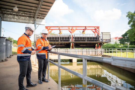 engineers are inspecting the wastewater treatment plant and checking the water in the treatment plant