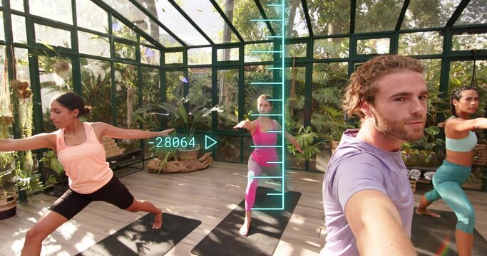 Filming purple-T man holding phone, shooting yoga on mats in greenhouse with AR readout, copy space - Powered by Adobe