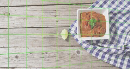 Placing square bowl with tomato dip, cilantro, lime on gingham-cloth on rustic wood, copy space © vectorfusionart