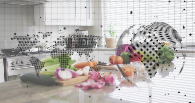 Displaying vegetables with chef's knife on wooden cutting board in kitchen, globe overlaying scene - Powered by Adobe