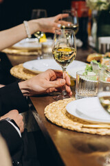 People celebrating a special occasion with white wine