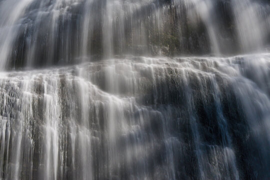Bridal Veil Falls misting over tiered rock formations