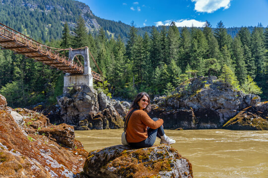 Woman contemplating Old Alexandra Bridge in British Columbia, Canada