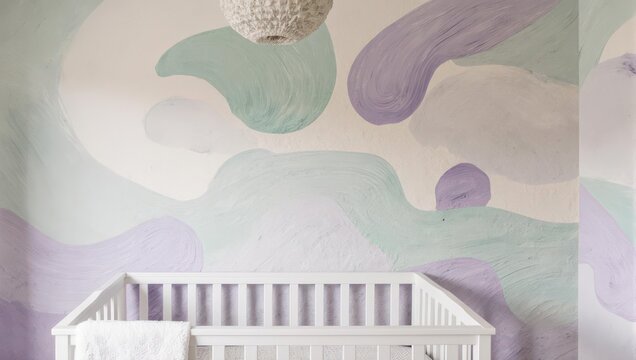 A nursery with a white crib and abstract painted wall design, lit by a textured overhead light