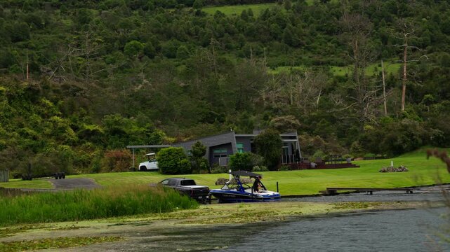 Car Towing Boat On Trailer At Lakeside Lodge New Zealand