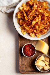 Crunchy fried pasta chips with dips.