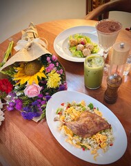 dinner - chicken with rice and vegetables and bouquet of flowers