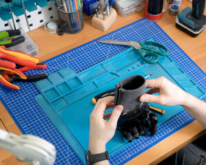 Setting up and adjusting a neurally connected hand prosthesis by a prosthetic technician