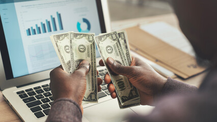 Businessman hands holding and counting dollars