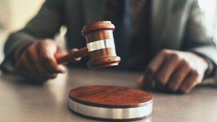 Judge with gavel on table