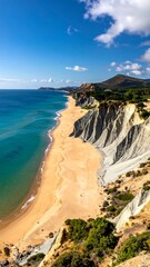 Cliffside beach view, showcasing golden sands meeting turquoise sea under a blue sky dotted with fluffy white clouds