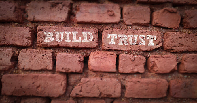 build trust message on brick wall for business communication concept