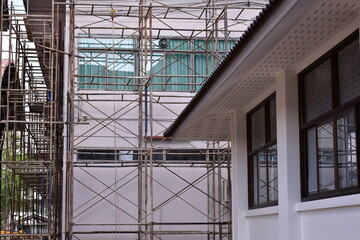 Building improvement construction area, steel scaffolding, Plastic sheeting