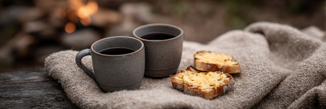 Cozy cabin morning coffee, wool blanket, fire pit, rustic bread comfort