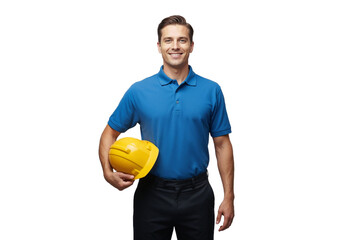 Man holds yellow hard hat in one hand and smiles wearing blue shirt and black pants in a bright setting