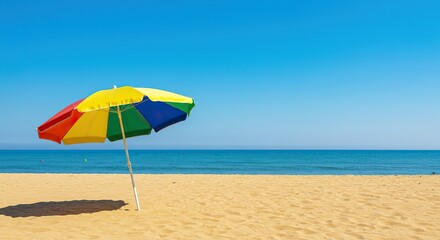 Vibrant beach umbrella firmly planted in golden sand, under clear blue sky, overlooking a tranquil ocean scene, perfect for summer relaxation ,open ,holiday ,coastal