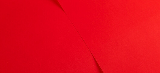 Bright cherry red paper material with matte surface and rich abstract color. Fine background in chic