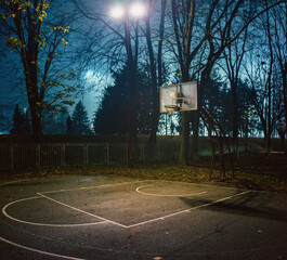 School basketball court at night in autumn