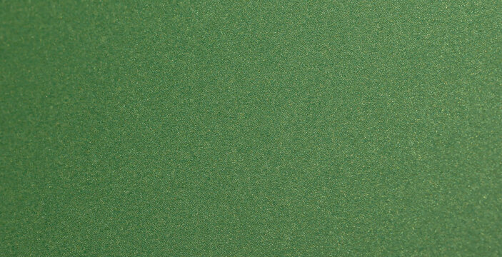 Deep forest green paper background with a smooth matte texture and subtle geometric patterns..