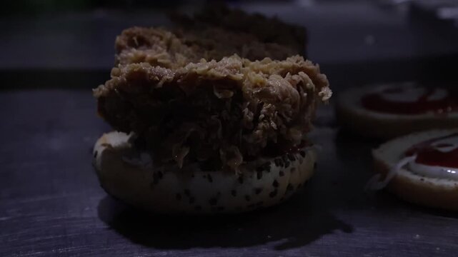 Putting Crispy Chicken Zinger On Burger Bun