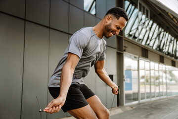 Male athlete jumping rope with concentration