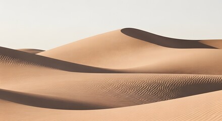 Rolling sand dunes under a clear sky in a desert landscape