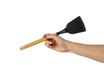 Hand with Black plastic kitchen spatula, kitchenware for cooking on transparent background.