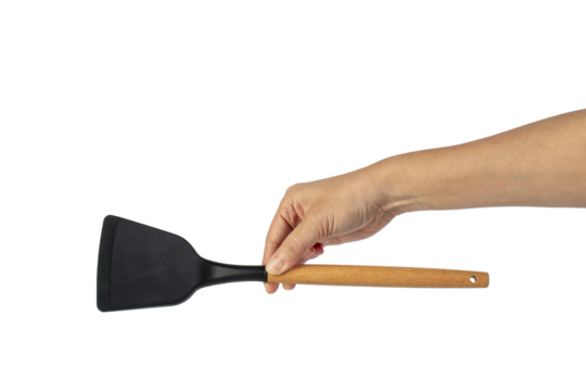 Hand with Black plastic kitchen spatula, kitchenware for cooking on transparent background. - Powered by Adobe